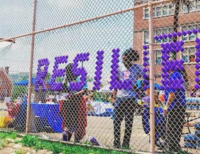 a fence with the word resilient