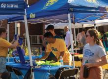 pitt staff work at a 2023 block party in oakland square