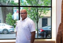 vernard alexander, director of the CEC in homewood, poses for a photo in front of a window at the CEC