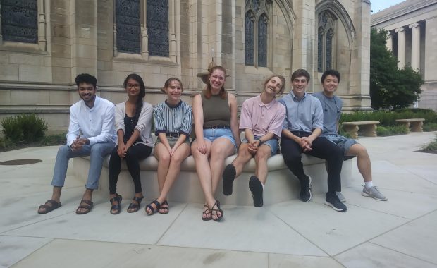 Students sitting outside Cathedral of Learning