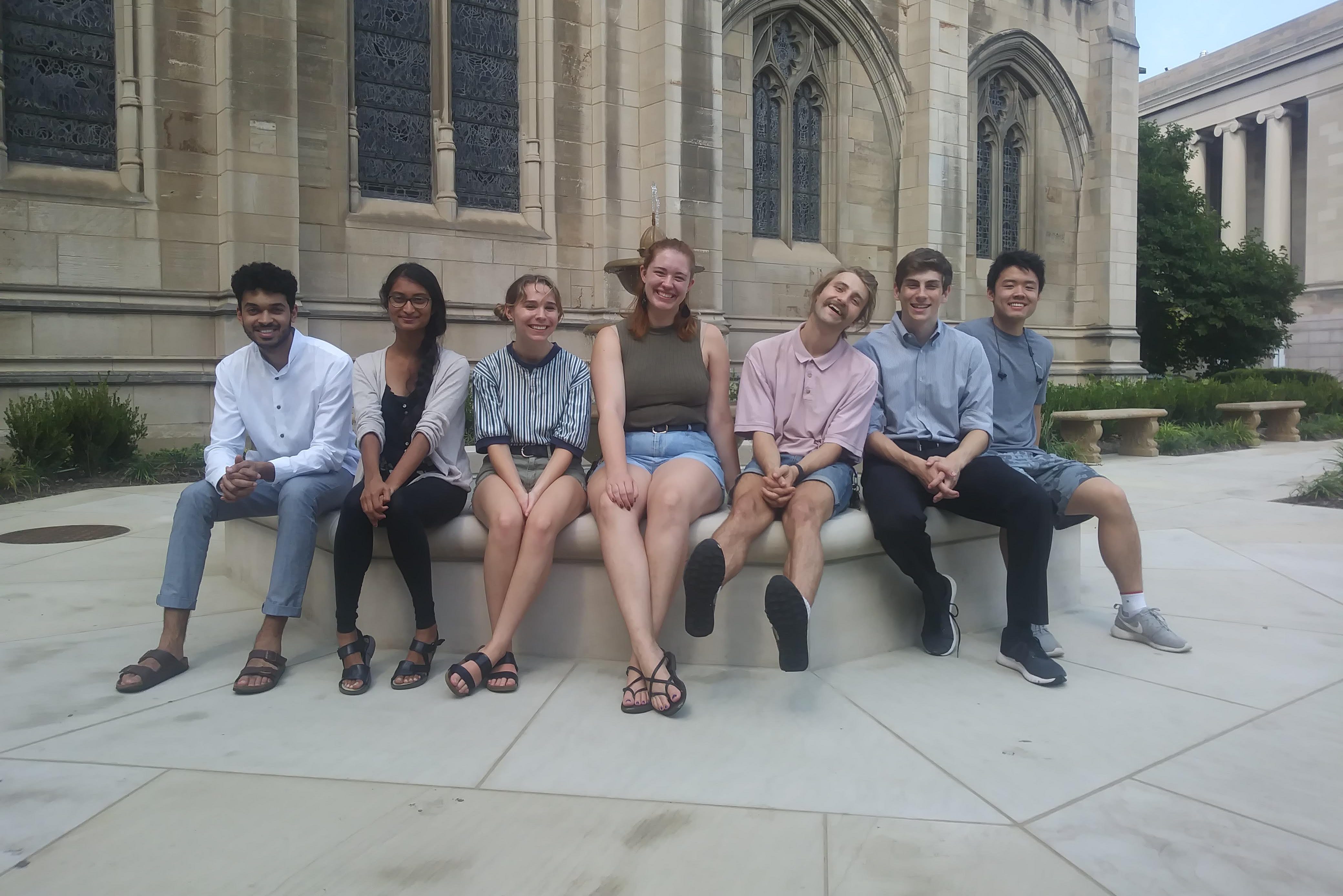 Students sitting outside Cathedral of Learning