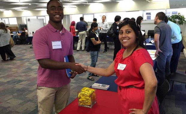 Community organization representative connecting with student
