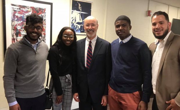 Governor Tom Wolf, Kirk Holbrook, and Community Assistants meet in the Hill District